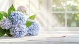 Beautiful background of hydrangea flowers with a clean, empty wooden table