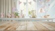 © zetrum - Empty wooden table in a blurry baby room with decorations