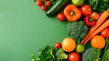 Fototapeta Kuchnia - Fresh Assorted Vegetables and Fruits on Vibrant Green Background for Nutritious Eating