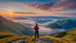 Tourists stand and admire the mountain landscape and mist. Beautiful sunrise panorama