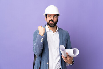 Wall Mural - Young architect man with helmet and holding blueprints over isolated purple background with unhappy expression