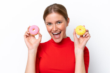 Wall Mural - Young caucasian woman isolated on white background holding donuts with happy expression