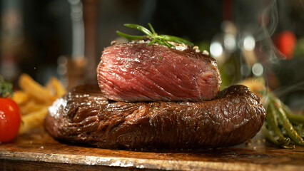 Wall Mural - A view of a fresh beef steak on a wooden board placed on the kitchen counter. The concept of meat preparation.