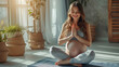 Pregnant woman practicing yoga at home, sitting in lotus position and meditating