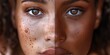 a close-up of a woman with five split screens showing different racial representations on her skin,