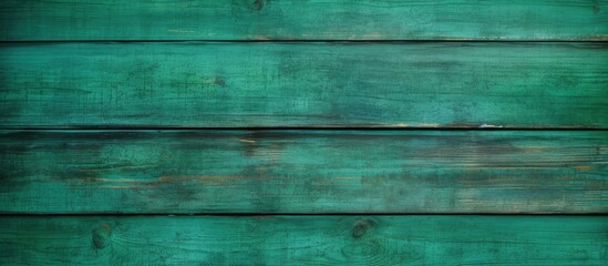 A detailed view of a vibrant green wooden wall, showcasing the texture and color variations of the wooden planks up close. The natural beauty of the wood is highlighted in this shot.