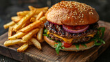 Fototapeta Sport - Top view of tasty cheeseburger with French fries