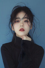 Sticker - Beautiful 22 year old Korean woman, Dior-like fashion, closed mouth smile, long black knit, eyes off, blue background paper