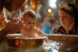 a cute small baby or toddler getting baptized the orthodox way swimming in water bathtub and a priest in golden attire performing the ritual praying christening