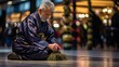 Chinese buddhist monk meditating in serene lotus position at traditional temple in china