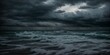 Storm clouds brooding over stormy seascape at dusky twilight 