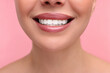 © New Africa - Woman with beautiful lips smiling on pink background, closeup