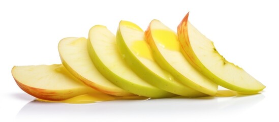 Wall Mural - A closeup of sliced Malus apples, a staple food and superfood, on a white surface. These natural foods are a delicious and nutritious ingredient in cuisine