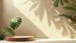 © Mark - This modern illustration shows an organic cosmetic or beauty product presentation podium with monstera leaves on a light beige background.
