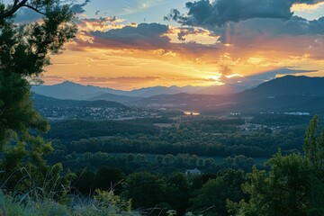 Wall Mural - the sun is setting over a valley with mountains in the background