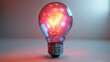 A light bulb is lit up and has a red glow. The light bulb is surrounded by a blurry background. The light bulb is the main focus of the image and it gives off a warm, inviting feeling