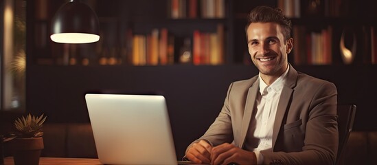 Poster - Focused Young Man Working on Laptop at Modern Desk in Cozy Home Office Environment