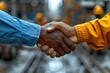 © Dejan - Hand with glove handshake with businessman.Architect and building engineer handshake close up