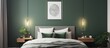 A bright bedroom featuring green walls, a white bed with a dark green coverlet hanging on a wooden bedhead, and a silver poster. The room exudes a fresh and clean ambiance.
