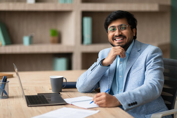 Aufkleber - Indian executive businessman sitting with smile taking notes at office
