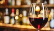 elegant glass of red wine on blurred bar background wine industry concept
