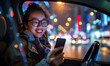 Urban Nighttime Drive - Smiling Woman Using Smartphone in Car