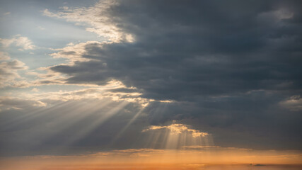 Wall Mural - after storm godrays with clouds as idyllicl natural background