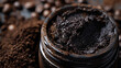 Detailed view of coffee scrub texture in an opened jar, symbolizing skincare and natural beauty products