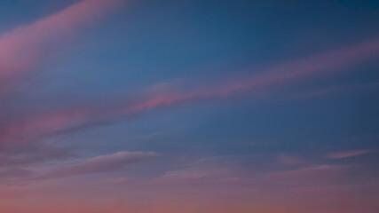 Wall Mural - romantic pastel sky with clouds at beautiful sunset as natural background
