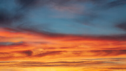 Wall Mural - Spectacular vibrant sky with clouds at beautiful sunset as natural background