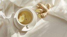a cup of healthy drinks with ginger on a white background, positioned beside a napkin, evoking a sense of wellness and vitality.