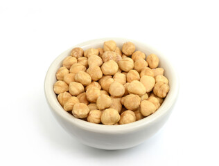 Wall Mural - Bowl of peeled hazelnuts isolated on white background. Package design element with clipping path