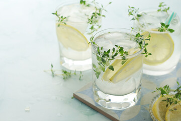 Wall Mural - Glasses with lemon and thyme refreshing drink	