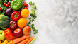 A bright collection of fresh fruits and vegetables arranged on a white textured background, perfect for healthy lifestyles