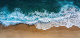 Fototapeta  - overhead view of ocean waves meeting a golden sandy shore