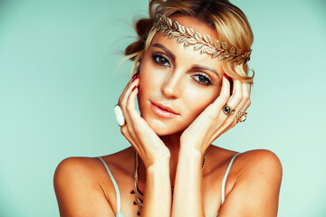 Poster - young blond woman dressed like ancient greek godess, gold jewelry close up isolated, beautiful girl hands manicured red nails