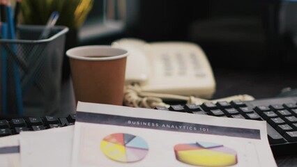 Poster - Corporate project investments report on desk next to paper cup of coffee, close up shot. Bookkeeping documents containing business analytics near hot beverage on table in office