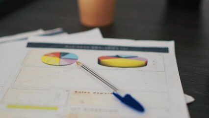 Poster - Paperwork on office desk containing business financial information such as balance sheets and income statements, extreme close up shot. Company invoice documents in accounting workspace