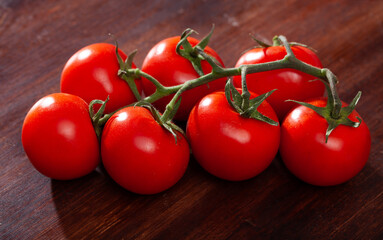 Wall Mural - Image of red tomatoes on wooden table in home kitchen