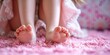 A close-up view of a persons intricately textured bare feet gracefully resting on a plush pink carpet, showcasing the delicate arches and slight movements of the toes.