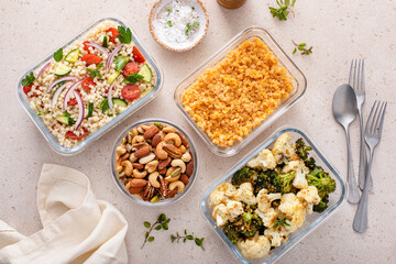 Canvas Print - Healthy vegan meal prep with roasted vegetables, cooked lentils, couscous salad and nuts