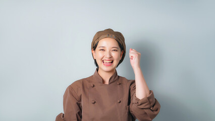Poster - ガッツポーズする調理服を着た女性