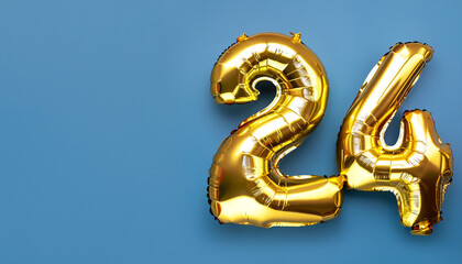 Wall Mural - Banner with number 24 golden balloon with copy space. twenty four years anniversary celebration concept on a blue background.