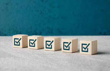 Checkbox symbols on wooden cubes.