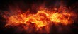 A large fire blazes fiercely against the darkness, illuminating the surroundings with its intense heat and bright flames. The fiery explosion dominates the scene, casting a stark contrast against the