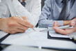 © Katsiaryna - two businessmen watching a growth chart close-up