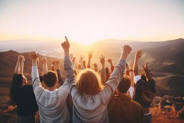 Poster - A group of people raising their hands in the air. Suitable for teamwork and success concepts