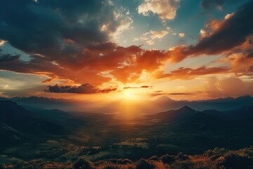 Canvas Print - Scenic view of the sun setting over a majestic mountain range. Perfect for travel and nature concepts