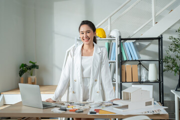 Portrait of Happy young Asian businesswoman looking at camera,arms crossed folded.Smiling woman executive manager,secretary offering professional business services standing in office. 