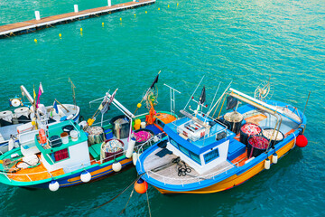 Wall Mural - Colorful fishing boats on the pier in Amalfi coast, Italy. Mediterranean sea coast.